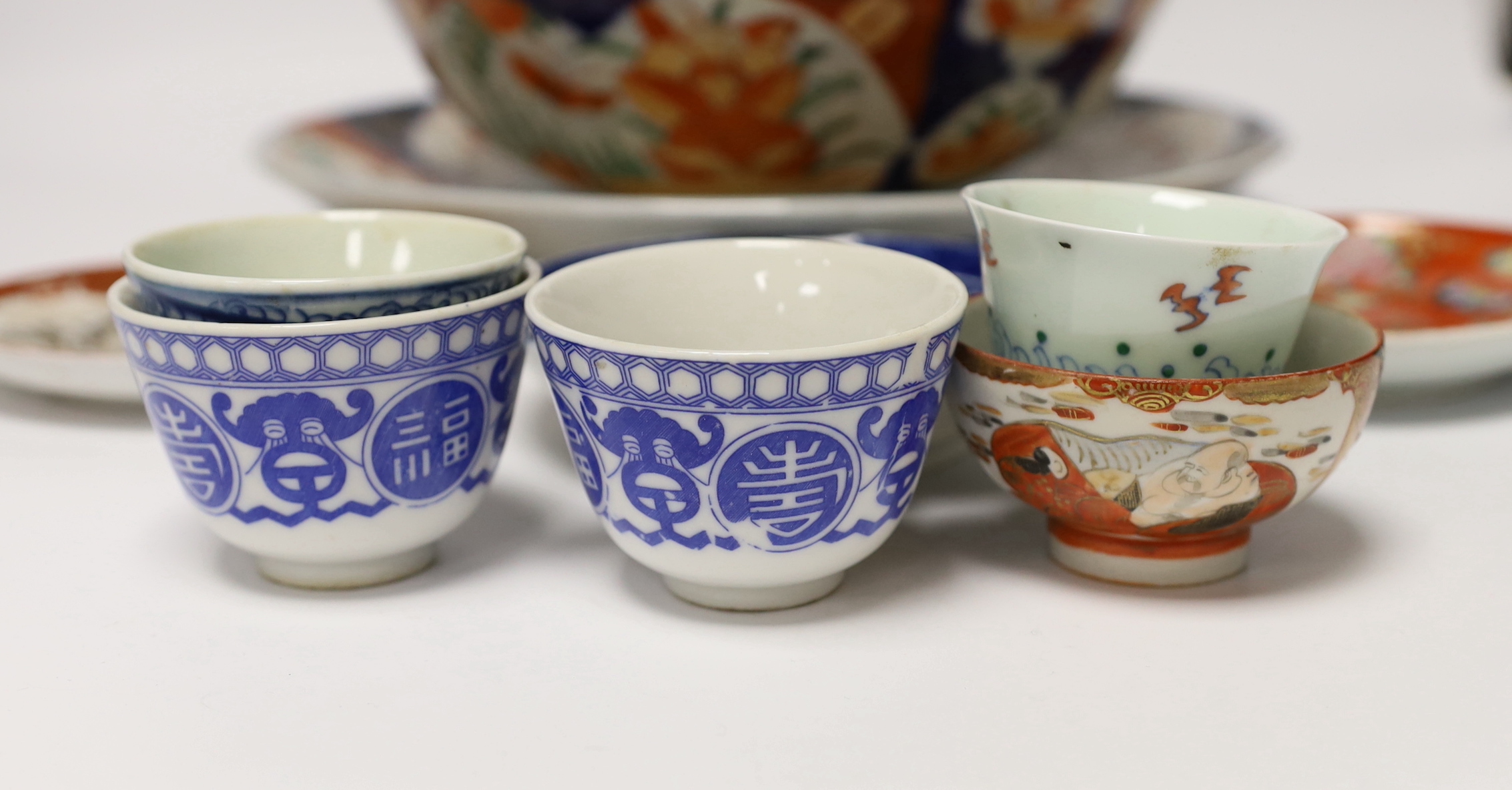 A group of Japanese Imari and kutani together with a Worcester blue and white saucer and a Chinese famille verte teabowl
